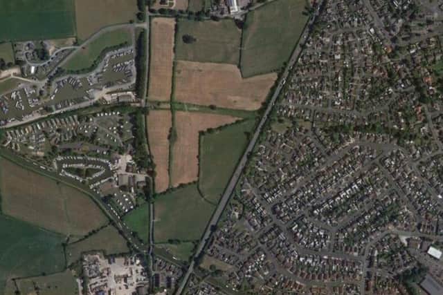 The triangular parcel of land where the houses and offices are set to be built (image: Google)
