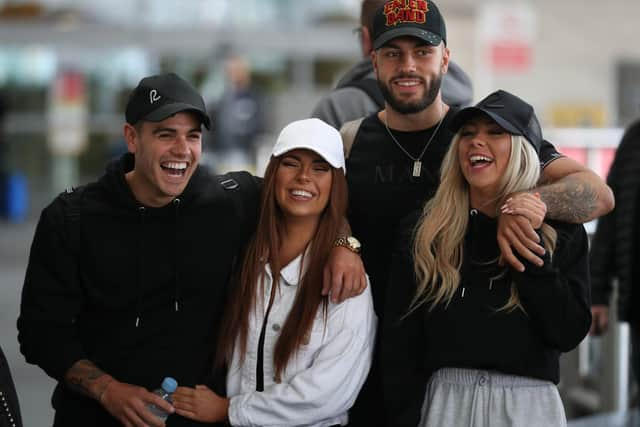 Love Island contestants, (couples left to right) Luke Mabbott and Demi Jones and winners, Finley Tapp and Paige Turley, after arriving at Heathrow Airport in London following the final of the reality TV show in 2020