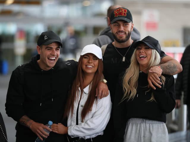 Love Island contestants, (couples left to right) Luke Mabbott and Demi Jones and winners, Finley Tapp and Paige Turley, after arriving at Heathrow Airport in London following the final of the reality TV show in 2020