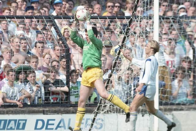 Preston goalkeeper Alan Kelly catches the ball in front of a packed away end at Shrewsbury
