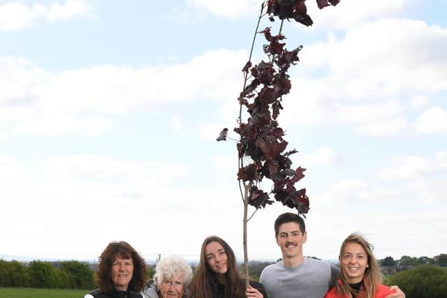 The Bradshaw family with the first sapling