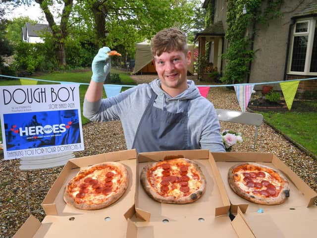 Joe Sullivan with  of his pizzas in support of the NHS