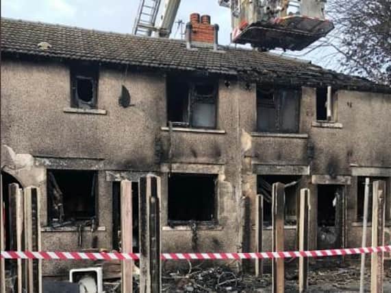 Damage caused to four houses when a rubbish fire in a garden got out of hand.