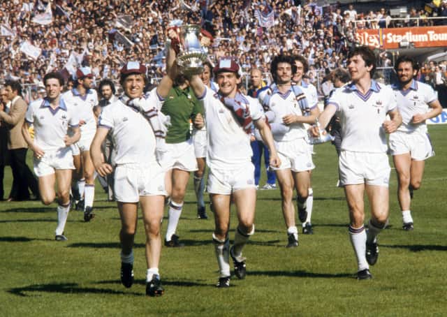 West Ham United's Geoff Pike and Paul Allen celebrate with the FA Cup