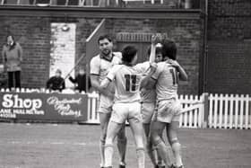 Bob Atkins (left), Gary Brazil and David Johnson congratulate Ian Stevens after the midfielder scored in Preston's win over York on May 11, 1985