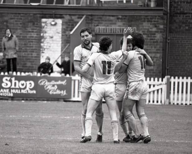 Bob Atkins (left), Gary Brazil and David Johnson congratulate Ian Stevens after the midfielder scored in Preston's win over York on May 11, 1985