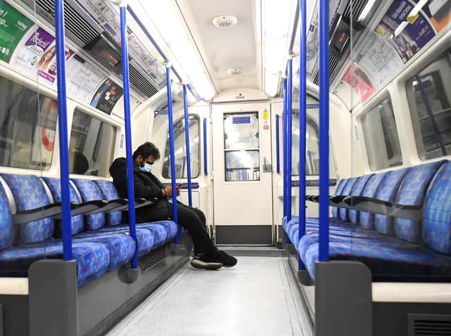 A passenger wears a protective mask on the London Underground on May 07, 2020 in London, England. Photo by Alex Davidson/Getty Images