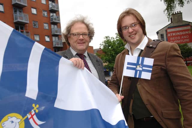 The Preston and South Ribble Civic Trust commissioned the flag for the city 10 years ago. (left) Civic Trust Member Aiden Turner-Bishop & (right) Flag Designer - Philip Tibbetts at the fag raising ceremony at Preston Minster in June 2012