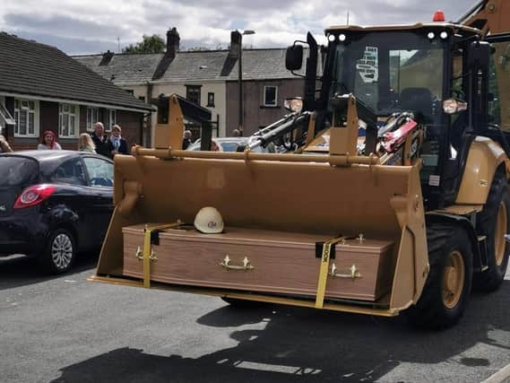 It was Roy Mellor's wish to be carried to his final resting place in a JCB, and his family made it happen for him