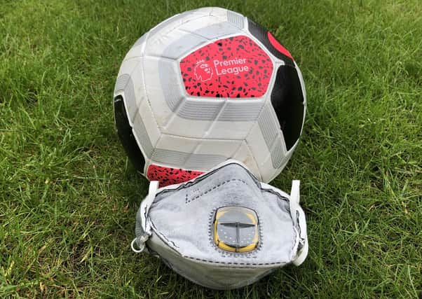 A Premier League ball and face mask