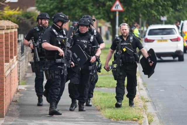 Armed police stand down after the three-hour siege.