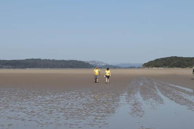 Two people taking part in a walk observing social distancing rules.