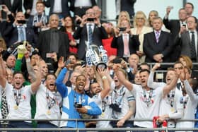 Preston North End lift the League One play-off final trophy at Wembley on May 24, 2015