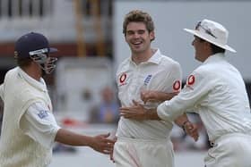 England's James Anderson (centre) celebrates with team mates Robert Key (left) and Michael Vaughan after bowling Zimbabwe's Travis Friend for a duck during the third day of the first test match at  in 2003