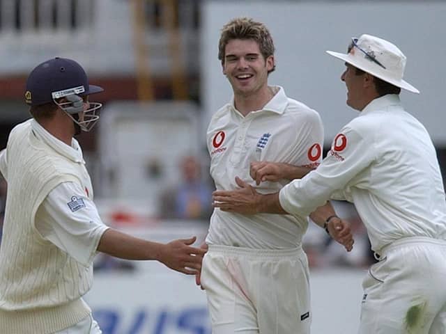 England's James Anderson (centre) celebrates with team mates Robert Key (left) and Michael Vaughan after bowling Zimbabwe's Travis Friend for a duck during the third day of the first test match at  in 2003