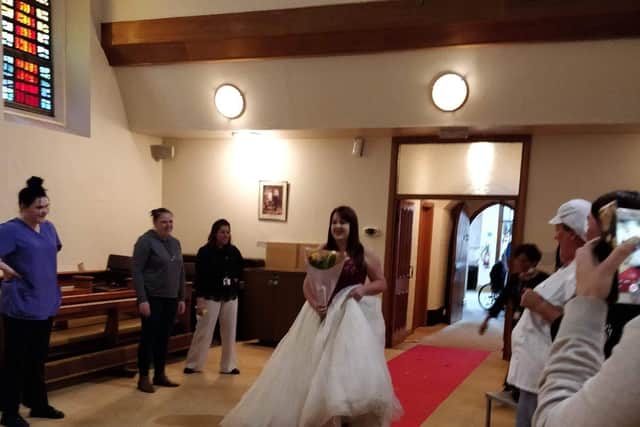 Rachel getting the red carpet treatment as she walks down the aisle in the home's chapel