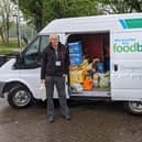 Foodbank trustee John Entwistle (left) with James Ventham from Windermere Lake Cruises.
