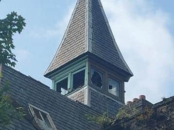 Leonie said she hadn't noticed the 'face in the window' of the bell tower until her friend saw it on Facebook and zoomed in to reveal the likeness of a young girl peering through the broken window panes