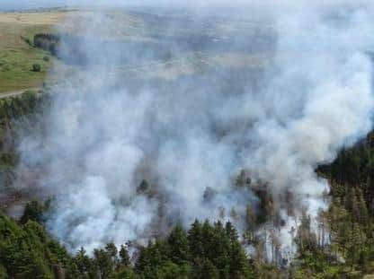 Firefighters have beentackling a woodland firebetween Darwen and Egerton. (Photo by @Lancs_FireDCFO)
