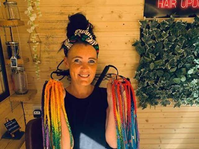 Buckshaw Village hairdresser Gemma Brown has been making children smile by hanging 10 colourful braids on trees for them to take home for free.