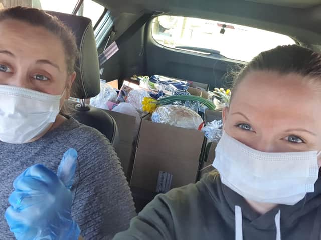 Heather, 32 and partner Caroline, 26, delivering food parcels to the community