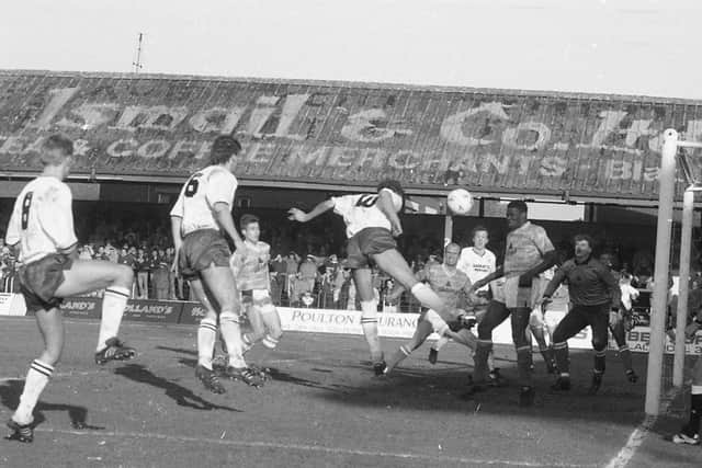 Preston's Mike Flynn (No.10) sees a header blocked in the Blackpool box, watched by Graham Shaw and Adrian Hughes