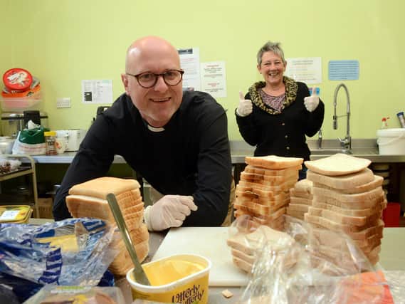 Associate vicar at St Thomas's Church, Lancaster, Rev Craig Abbott and Ark co-ordinator, Anne Carman, preparing food. Picture: Darren Andrews.