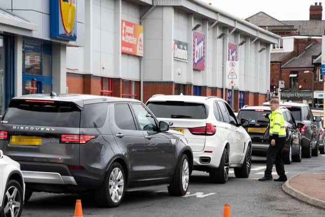 McDonald's staff managing traffic due to severe congestion at the retail park