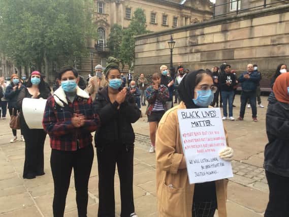 People socially distanced and held signs, showing support for Black Lives Matter