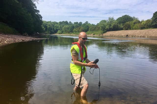 Environment Agency fisheries officer Damien Linney tests oxygen levels at Samlesbury following the removal of the weir.
