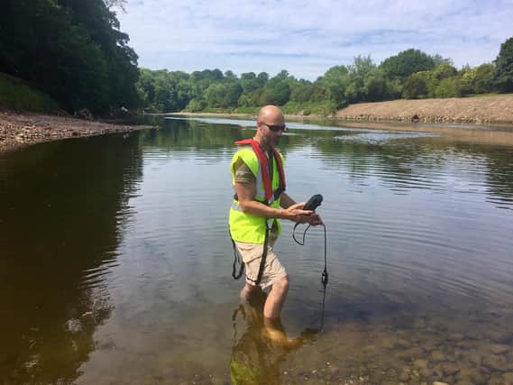 Environment Agency fisheries officer Damien Linney tests oxygen levels at Samlesbury following the removal of the weir.