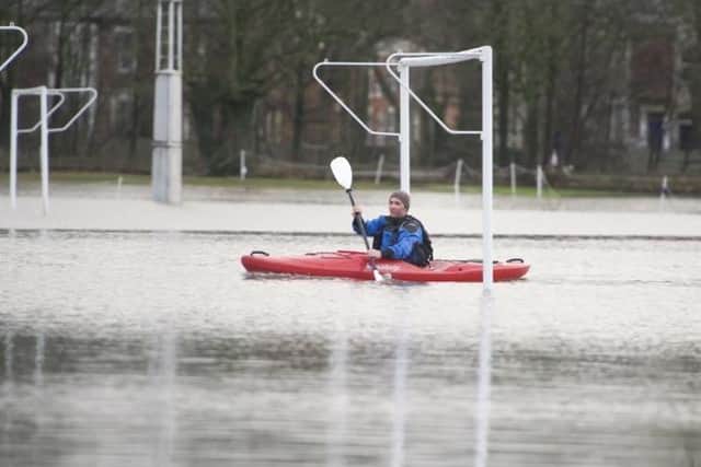 Canoe believe it? Flooding stops play on football pitches at Penwortham Holme.