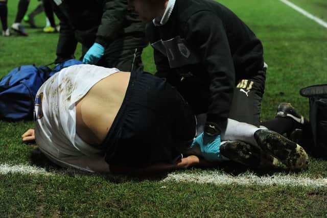 Scott Laird is treated for a serious injury during Preston North End clash against Notts County at Deepdale in 2012