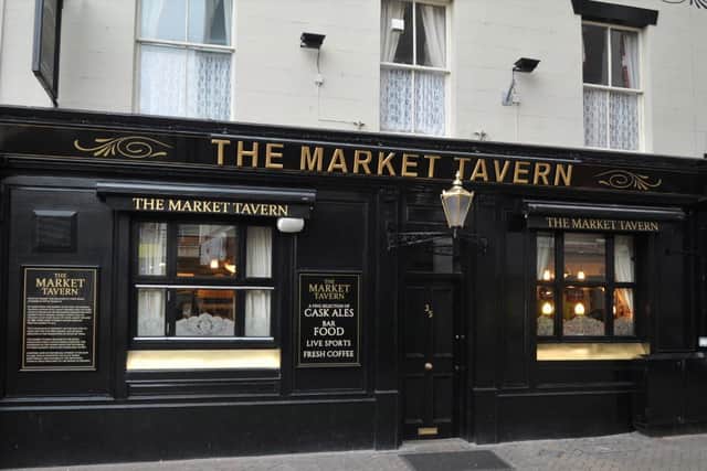 The Market Tavern, Preston, also opened for takeaway service with customers enjoying a pint of cold beer outside the pub