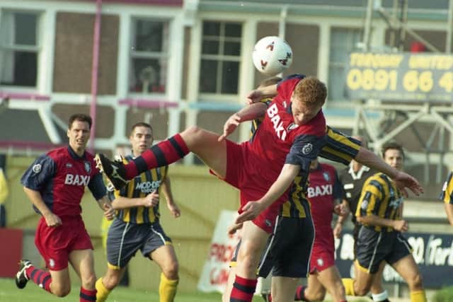 North End centre-back David Moyes battles for the ball against Torquay
