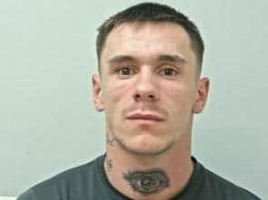 Reece Cartledge (pictured) has a number of distinctive tattoos, including the words only god can judge me and a picture of an eye on his neck. (Credit: Lancashire Police)