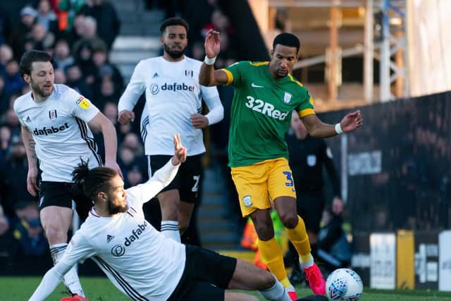 PNE's Scott Sinclair rides a challenge from Fulham's Michael Hector