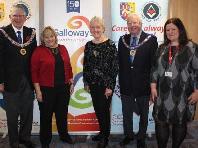 Leader of West Lancashire Freemasons Tony Harrison with partially sighted service users Linda McCann, from Preston, and Laurel Devey from Southport, and Nicola Hanna, head of income generation at Galloways. The meeting took place before the
lockdown was announced.