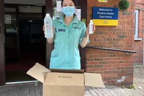 Receiving the UCLan-made  sanitiser at Preston Grange