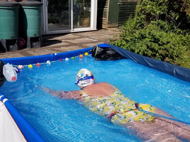 Audrey Hellan swimming in her back garden in Longton