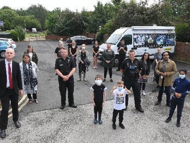 Coun Matthew Brown, left, with residents, councillors and police