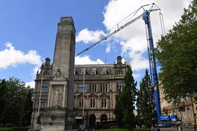 A huge 40-metre crane towers over the old Post Office.