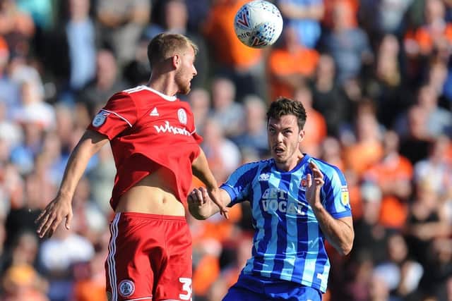 Connor Simpson (left) in action for Accrington Stanley against Blackpool while on loan from PNE