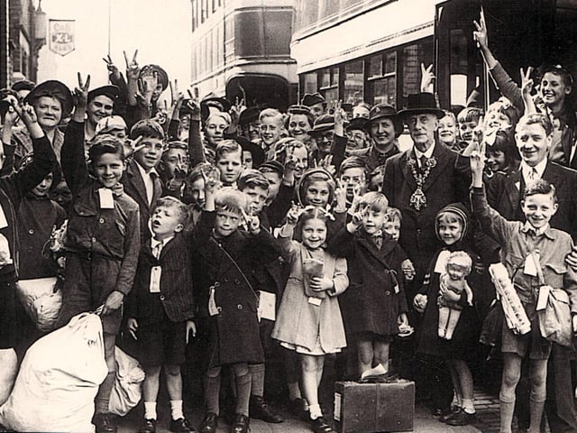 Mayor of Preston Coun J E bids farewell to the evacuees as they prepare to head home at Preston railway station