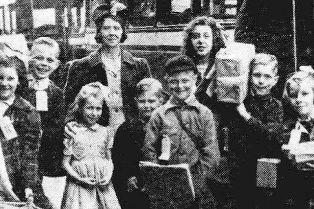 Mrs Stewart with some  of her 11 evacuee children at Preston railway station