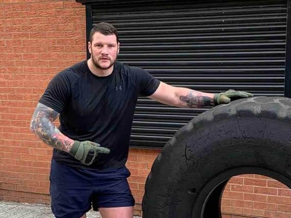 Heavyweight boxer Bill Hodgson has been training hard for the tyre flip challenge