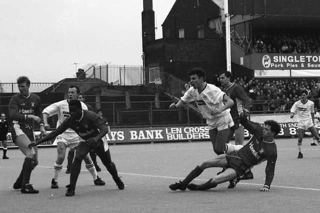 North End defender Mike Flynn has a chance against Cardiff, watched by John Thomas