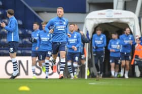 Captain Tom Clarke leads Preston out for the pre-match warm-up during a Championship game this season