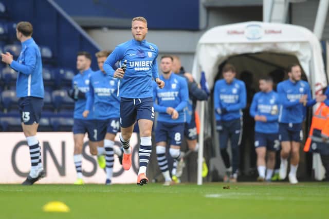 Captain Tom Clarke leads Preston out for the pre-match warm-up during a Championship game this season