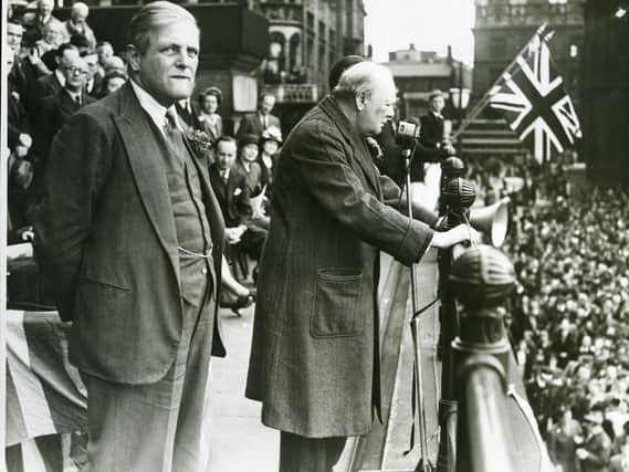 Prime Minister Winston Churchill addresses a crowd gathered on Prestons Flag Market from the steps of the Harris Library on June 27, 1945